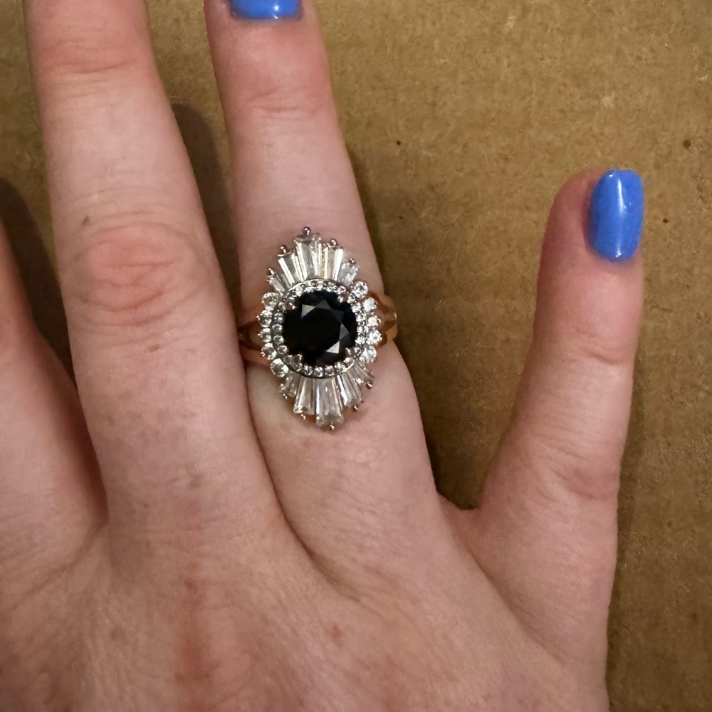 Henri Bendel ring In rose gold with clear stones, middle stone is black. Size 6